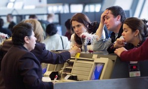 British Airways agents assist passengers at the British Airways